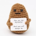 Close-up of a brown crochet potato toy holding a sign with a sweet English message - Dark Brown Potato Y Card