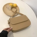 Minimalist khaki leather crossbody bag with adjustable strap and refined texture - Khaki