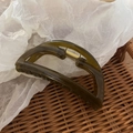 Close-up of a dark green hair claw clip with golden spring on a rustic tray background - 3# Green