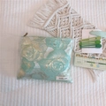 Detail of mint green rose jacquard fabric with gold thread and simple wish label - Light Green