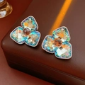 Detailed view of luxury rhinestone floral earrings with blue and orange crystals - Silver Earring Post-Blue
