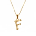 Close-up of gold stainless steel necklace with bamboo texture letter F pendant - Letter F