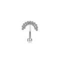 Macro detail of silver curved piercing jewelry with heart-shaped pave-set zircons - Pave Rhinestone Arch Style