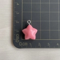 Detailed size measurement of pink resin star pendant with ruler on a black cutting mat - Watermelon Red Star Pendant