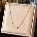 Collar de lazo en acero inoxidable chapado en oro con circonitas en su estuche - Estilo Lazo Zirconia (N4084)