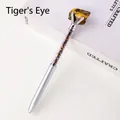 Silver metal ballpoint pen featuring natural tiger eye stone beads in a transparent barrel - Tiger's Eye