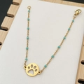 Golden boho beaded chain bracelet with turquoise beads and a round paw print pendant - Green