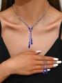 Close-up of elegant dark blue crystal tassel necklace and matching earrings set on model - 603 Royal Blue Necklace + Stud Earrings Set