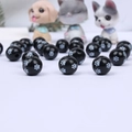 Detailed close-up of round black wooden beads featuring white paw print patterns - Black Base White 3-Paw
