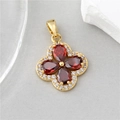 Macro detail of golden four-leaf clover pendant with red stones and white zirconia - H-10950 Red Zircon Clover Pendant (Gold Base)