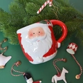 3D Santa Claus embossed ceramic mug with festive red handle and glossy finish - Leaf Santa Mug 400ml