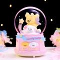 Pink snow globe featuring yellow bear and white puppy figures on a carved base - 8514 Prone Position / Medium 80# LED Light+Music