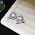 Detailed close-up of grey pearl earrings with diamond-encrusted metal bars on a jewelry cushion - 14# Silver Needle Grey Pearl Rhinestone Bar Stud Earrings