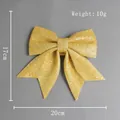 Fiocco di Natale dorato con glitter, ornamento decorativo leggero da 20x17cm - Oro