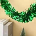 Close-up of shiny green Christmas tinsel garland with metallic foil for party decor - 9cm*2m / Bright Green