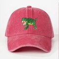 Detailed close-up of green dinosaur embroidery on vintage red washed cotton baseball cap - One Size / Watermelon red