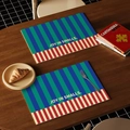Waterproof leather placemat with blue-green stripes and Joy in Smalls printing - Blue Striped