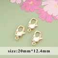 Three 20mm golden lobster clasps for DIY jewelry making on a decorative green background - M82412 Gold Spring Hook Clasp