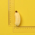 Handmade yellow crochet banana keychain pendant measuring approximately 4.5cm by 1.5cm - Yellow Handmade Crochet Banana