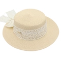 Close-up of beige straw boater hat featuring a white lace ribbon and bow decoration - One Size / Off White