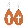 Detail of wooden teardrop earrings featuring a hollow cross design on a white background - Style 34/Teardrop Cross Hollow