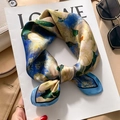 Silk scarf with blue floral print on magazine in a stylish fashion setting - White Rose Oil Painting