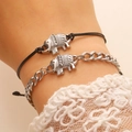 Detailed shot of elephant charm bracelets with silver cuban chain and black woven cord - Bracelet And Rope Set / Silver