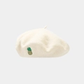 Detailed view of cream wool beret featuring delicate yellow pineapple embroidery - One Size / White