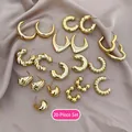 20-piece set of gold geometric hoop earrings with twisted and heart-shaped designs - 20-Piece Set / Gold