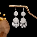Ethnic style silver tassel earrings with hollow patterns on black background - Silver Hollow Pattern Tassel Style (E2871-5)