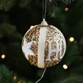 8cm gold sequined Christmas ball with white stars and HO letters hanging on tree - Gold