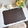 Dark brown leather placemat with vintage European embossed pattern and wavy edges - Embossed Totem Coffee