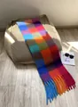 Rainbow plaid scarf with long fringes in soft wool style on a cozy beige sofa - AC Rainbow Series