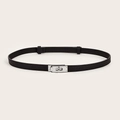 Detail of slim black leather belt featuring a classic silver metal swivel lock buckle - (Silver Buckle) Cross Pattern Lock Adjustable Belt (Black)