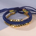 Set de pulseras de cordón azul marino tejidas a mano con cuentas doradas irregulares - Set de 3 piezas