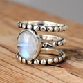 Vintage triple-layer silver bead ring featuring a glowing moonstone on a wooden surface - US 6 / Antique Silver