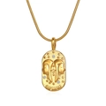 Detail of a gold Gemini zodiac oval pendant necklace with zircons on a snake chain - Gemini