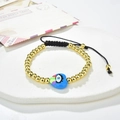 Detail of adjustable woven bracelet with golden beads and blue heart evil eye charm - Rainbow Blue Heart