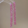 Detail of square Greek Key tassel earrings featuring shimmering pink rhinestones - Rose Red