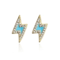 Macro shot of 18K gold plated lightning bolt earrings with blue enamel and zircons - Gold-Blue