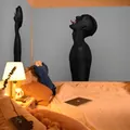 Artistic wall tapestry featuring a surreal black silhouette portrait in neutral grey background - 150x130cm / WSJ45 Dark Art Silhouette