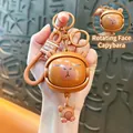 Adorable cartoon Capybara keychain with a unique rotating face feature for backpacks - Turning Face Pendant - Coffee