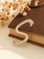 Elegant gold letter S brooch with clear rhinestones on vintage book background - Gold Letter S