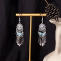 Bohemian silver tassel earrings featuring turquoise beads on a gold display stand - S4295 Blue Seed Bead Tassel Earrings
