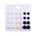 Detail view of 12 pairs of multi-sized faux pearl stud earrings in white, beige, and black - Classic Three-Color Ball Set (E0124-1)