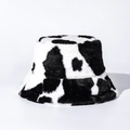 Close-up of soft faux fur texture and black and white cow print on the plush bucket hat - M (56-58cm) / Black