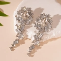 Close-up of sparkling silver tassel earrings with crystal teardrops on a stone base - Silver Pin Water Drop Tassel Style / Silver