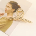 Large gold alloy hair claw clip featuring a stylish intertwined metal chain design - Chain Ribbon Style