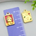 Macro view of gold-plated safety lock charms with enamel Pingan text and size ruler - Double-Sided Buddha & Guan Yin Icon