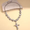 Detail of silver chain necklace with geometric crystals and a sparkling cross pendant - Silver